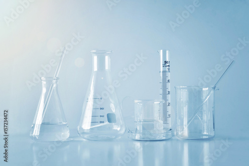 Group of laboratory glassware on table, Symbolic of science research.