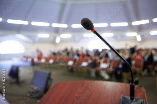 Microphone on stand in front of audience