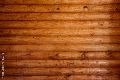 Wooden wall from logs as a background