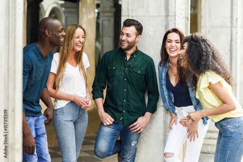 Multi-ethnic group of friends having fun together in urban background