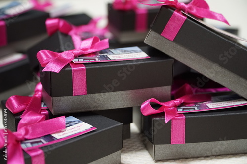 Black and grey giveaway boxes with ribbons