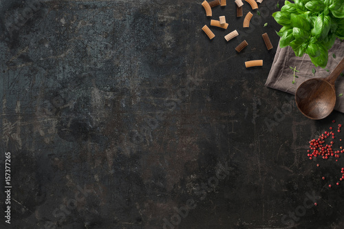 Kitchen and Cooking | Italian ingredients (pasta, pepper, basil) on a vintage board