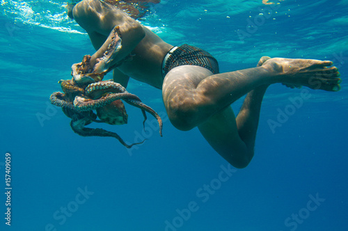 Bajau fisherman catching an Octopus