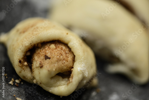 Dough rolling for cinnamon rolls. Close-up. Selective focus