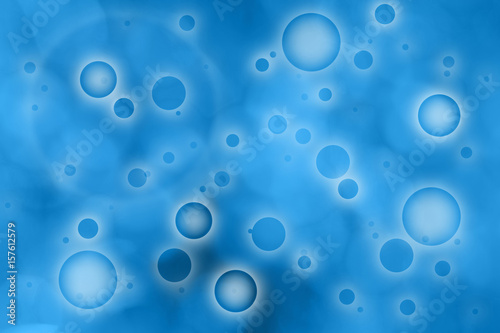 Abstract blurred circle pattern on the blue colored background.