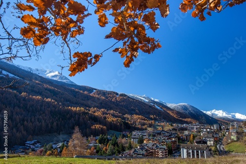 The bright colors of the autumn painting the popular ski resort of Aprica in Valtellina Orobie Alps, Sondrio, Lombardy, Italy Europe