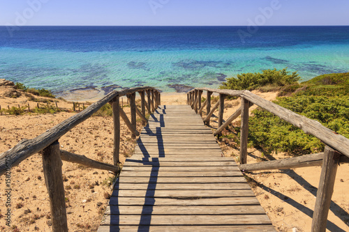 The most beautiful beaches of Italy. Campomarino dune park: fence between sea dunes,Taranto (Apulia). The protected area extends along the entire coast of the town of Maruggio.