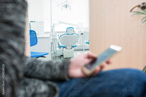 Three patients sitting in doctor's waiting room