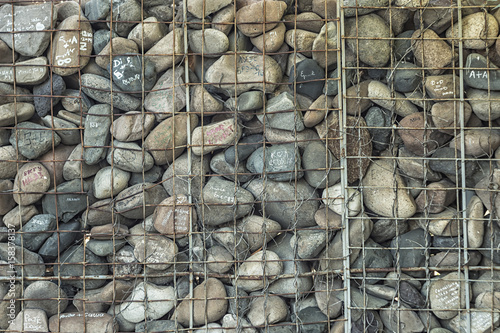 The stones with the inscriptions and the iron grating