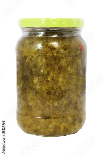 Isolated jar of pickle relish with green cap. Vertical.