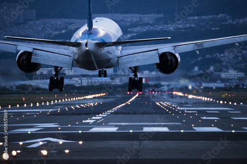 In the evening, the plane is about to land on the runway