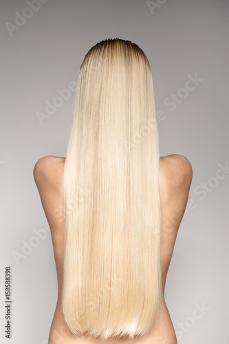 Portrait Of A Beautiful Young Blond Woman With Long Straight Hair
