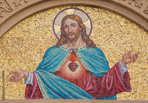 TURIN, ITALY - MARCH 15, 2017: The mosaic of Heart of Jesus on the facade of Chiesa del Sacro Cuore di Gesu on the square Piazza Maria Ausiliatrice by unknown artist from end of 19. cent.