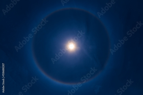 sky sun halo phenomenon in blue dark blue sky.
