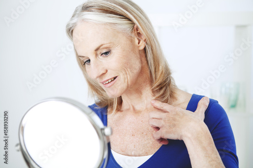 Elderly person with mirror