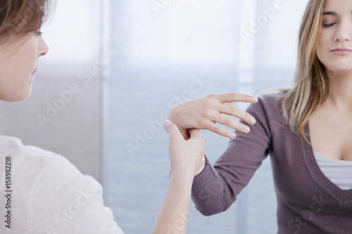 Woman undergoing hypnosis session