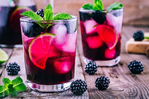 Blackberry mojito cocktail with lime, and mint