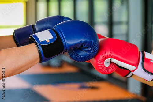 Red and Blue boxing gloves in Gym Fitness
