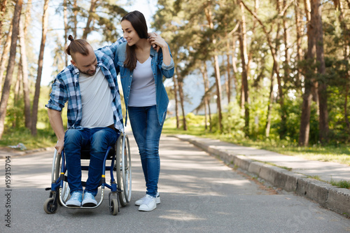 Disabled male person trying to stand up