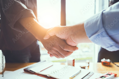 Business engineer team shaking hands to agree to joint business agreements in the future. About the creation of real estate and housing projects for government projects.