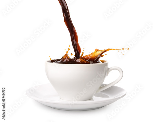 Pouring coffee into cup with splashing., Isolated on white background.