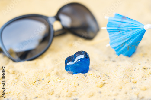 Cocktail umbrellas on the sand of a sunny beach.