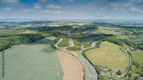 Aerial view of Sittingbourne & Maidstone Roads roundabout and M2 motorway with a nice skyline and green field in Kent, UK