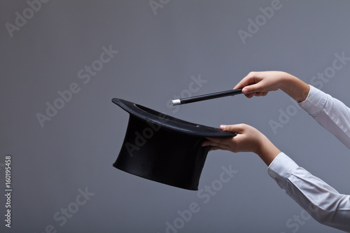 Magic hat and wand in child hands