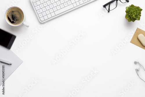 Keyboard With Office Supplies On White Desk