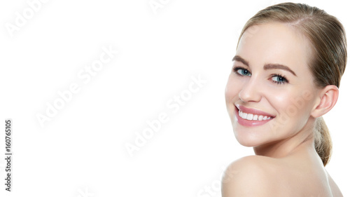 Beautiful young blond smiling woman with clean skin, natural make-up and perfect white teeth white background