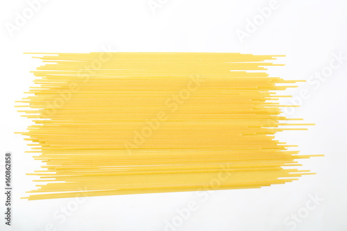 Raw spaghetti noodle isolated in white background