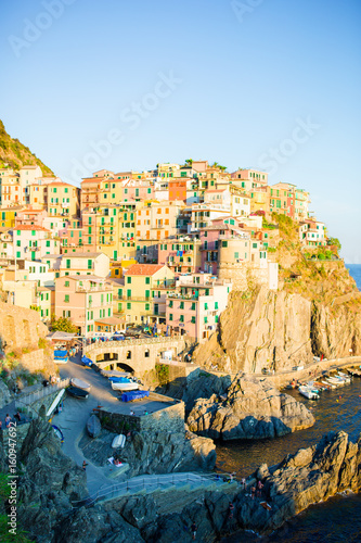 Stunning view of the beautiful and cozy village of Manarola in sunset, Cinque Terre Reserve. Liguria region of Italy.