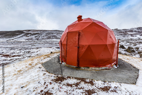 Red geodesic shed for technical equipment near the Krafla geothermal power plant at Lake Myvatn, Iceland