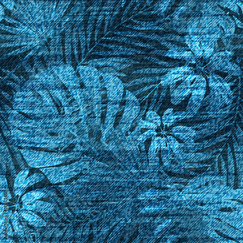 Vector denim exotic leaf seamless pattern. Faded jeans background with tropical plants. Blue jeans cloth background