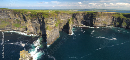 World famous birds eye aerial drone view of the Cliffs of Moher in County Clare, Ireland. Beautiful Irish Countryside Landscape on the Wild Atlantic Way route.