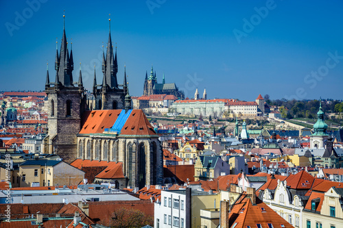 Overview of Prague rooftops, Church of our Lady before Tyn and Prague Castle on a sunny day