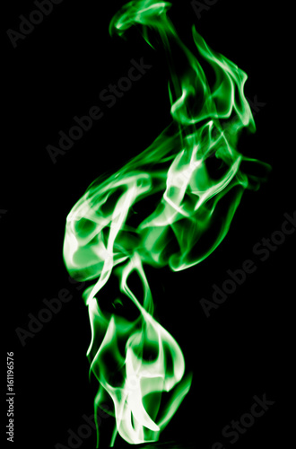 Green flame of fire on a black background