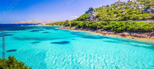 Emerald green sea water and rocks on coast of Maddalena island, Sardinia, Italy