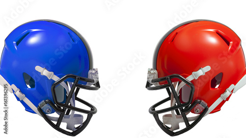Athletic rivalry, sports encounter or red vs blue concept with two american football helmets facing each other in conflict, the red helmet versus the blue helmet with copy space