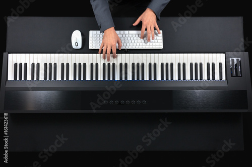 Pianist playing electric piano with jacket