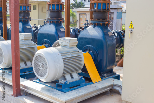 Electric motors driving water pumps of waste water treatment system.