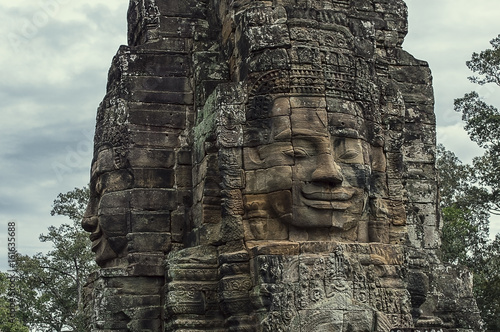 Stone head on towers of Bayon temple in Angkor Thom, Cambodia