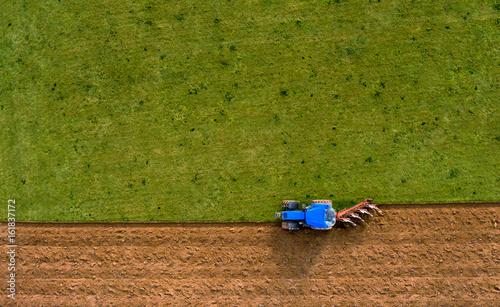 Tractor Ploughing Plowing Field - Aerial Shot