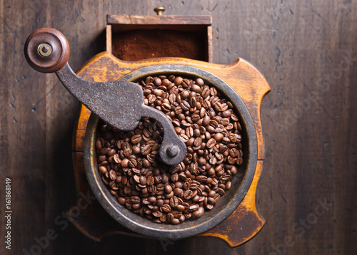 close-up of old coffee grinder and roasted coffee beans