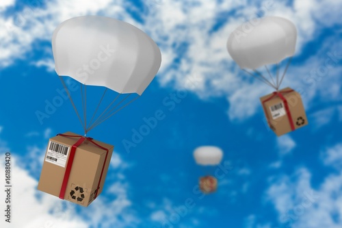 Composite image of 3d image of parachute carrying cardboard box