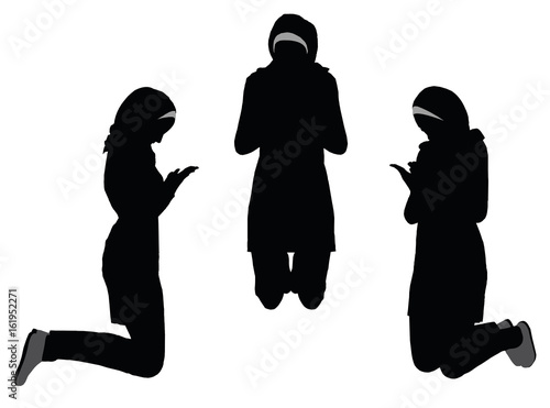 Muslim woman silhouette in pray pose
