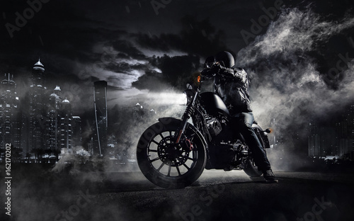 High power motorcycle chopper with man rider at night