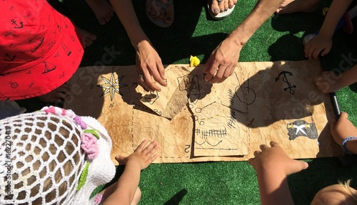 Children collect an old treasure map