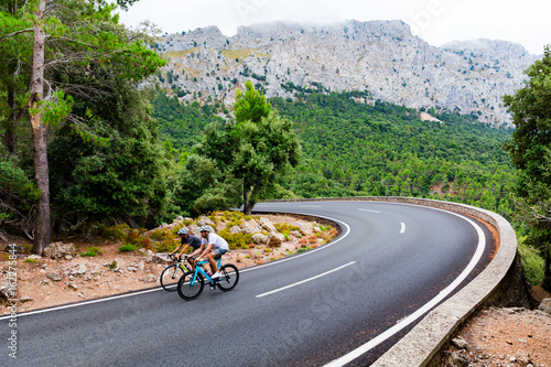 Cyclists riding up the Puig Major peak in Majorca
