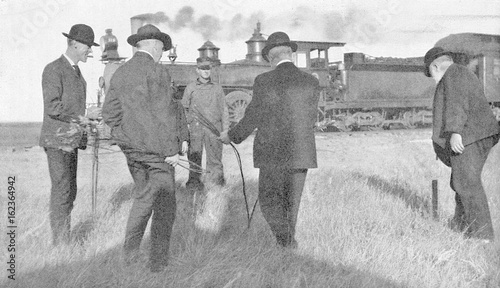 Water dowser and steam train 1907.. Date: 1907